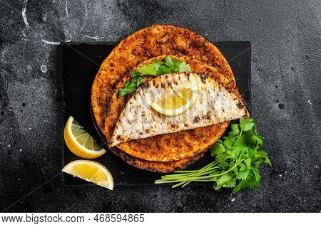 Lahmacun Traditional Turkish Pizza And Wraps With Salad On Marble Board With Spices. Black Backgroun