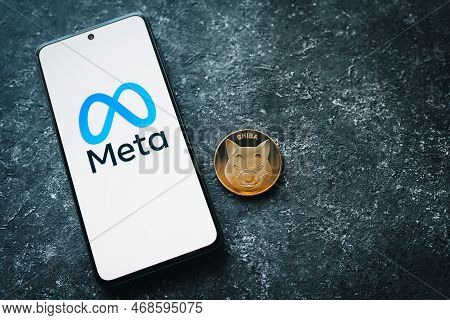 Shiba Inu Crypto Coin And Meta Logo On Phone Screen. Shib Token And The Metaverse. Mshiba Or Meta Sh