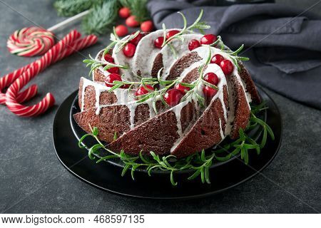 Christmas Chocolate Bundt Cake. Traditional Christmas Fruit Cake With White Glaze, Cranberries And R
