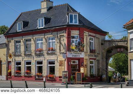 Bergues, France - July 5. 2022: An Old Traditional House On A Clear Day In France, Blue Sky, Summer