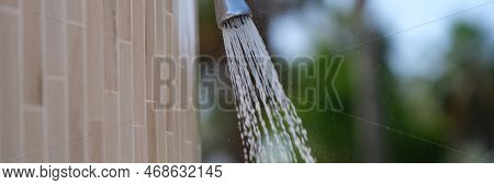 Detail Of Outdoor Water Shower On Beach. Water Pouring From The Shower On The Street Concept