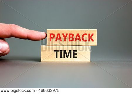 Payback Time Symbol. Concept Words Payback Time On Wooden Blocks. Beautiful Grey Table Grey Backgrou