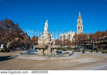 Nimes, Occitanie, France, 12 31 2022 - The Pradier Fountain And Statue At The Esplanade Square In Ol