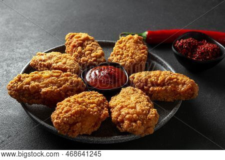 Popular Street Food Snack- Pakora With Red Pepper. A Plate Of Traditional Indian Or Pakistani Dipped