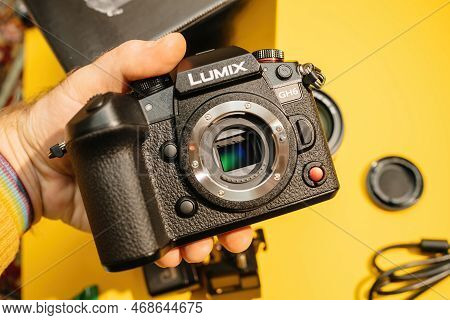 Paris, France - Nov 20, 2022: Pov Male Hand Holding New Panasonic Lumix Dmc-gh6 Micro Four Thirds Sy