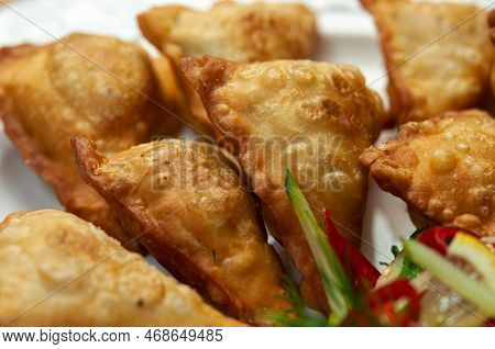 Closeup A Plate Of Fried Dumplings. Delicious Japanese Pan-fried Dumplings Calls Gyoza Or Known As C