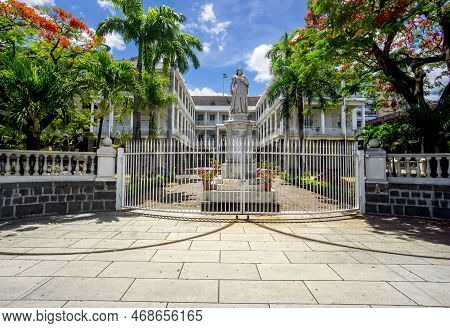 Port Louis, Mauritius, December 2021 - Main Gate Of The Government House, With The Statue Of Queen V