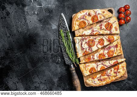 Homemade Flammkuchen Or Tarte Flambee With Cream Cheese, Bacon, Tomato And Onions. Black Background.