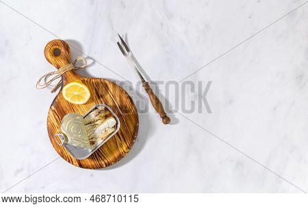 Tinned Fish Board, Sardines In Conservas. Mediterranean Appetizer Platter With Lemon. Top View, Copy