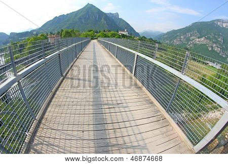 Long Bridge With A Wooden Walkway And Handrail Made Of Galvanized Steel