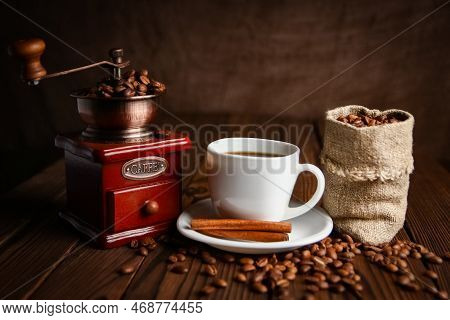 A Coffee Grinder And Coffee Background A