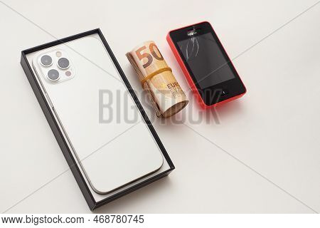 Stariy Oskol, Russia - July 5, 2021: New Smartphone On Table Next To The Old Phone, Buying A New Pho