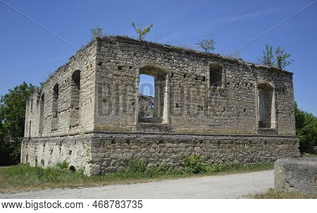 Ruins Of A Jewish Synagogue In The Moldavian Village Of Rashkov. The Walls And Roof Were Overgrown W