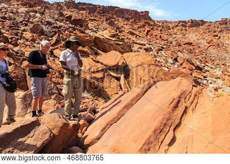 Twyfelfontein, Damaraland, Namibia - 05 October 2018: Tourists In Twyfelfontein, Site Of Ancient Roc