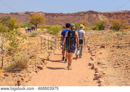 Twyfelfontein, Damaraland, Namibia - 05 October 2018: Tourists In Twyfelfontein, Site Of Ancient Roc
