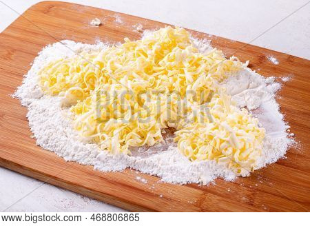Frozen Grated Butter And Flour. Making Chopped Dough Or Quick Puff Pastry. Baking Ingredients