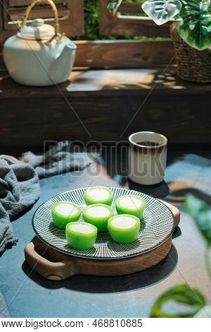 Malaysian Food Kuih Nona Manis Or Nona Manis Cake, Soft Steamed Pudding With Pandan Leaves