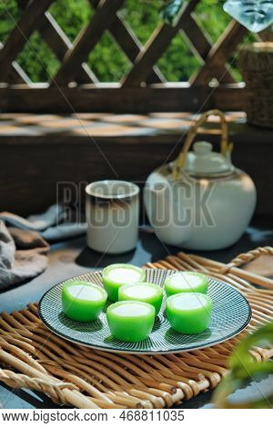 Malaysian Food Kuih Nona Manis Or Nona Manis Cake, Soft Steamed Pudding With Pandan Leaves