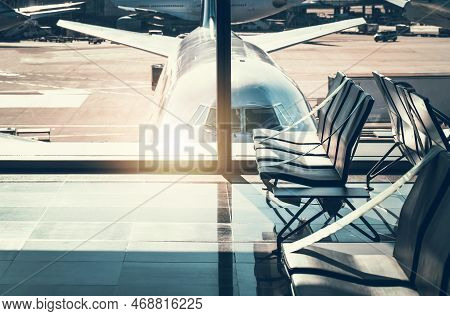 Empty Chairs Inside International Airport Terminal. Awaiting Flight Theme.