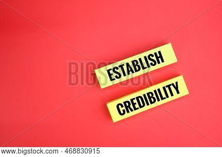 Yellow Paper With The Words Establish Credibility. The Concept Of Credibility
