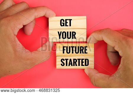 Hand Holding A Stick With The Words Get Your Future Started. Concept How To Start For The Future. Fu