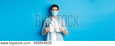 Concept Of Coronavirus, Quarantine And Social Distancing. Young Man Searching Apartment, Showing Hou