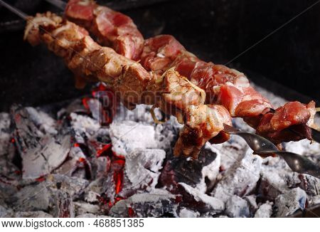 Souvla -  Popular Dish From Cyprus. It Consists Of Large Pieces Of Meat Cooked On A Long Skewer Over