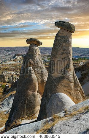 Stone Statues Three Graces On Urgup In Cappadocia. 
Three Beauties In Capadocia, District Of Nevsehi