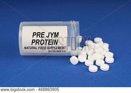 The Concept Of Pharmacology And Health. On A Blue Surface Are Pills And A Dusty Jar With The Inscrip