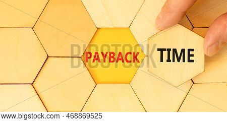 Payback Time Symbol. Concept Words Payback Time On Wooden Puzzles. Beautiful Yellow Table Yellow Bac