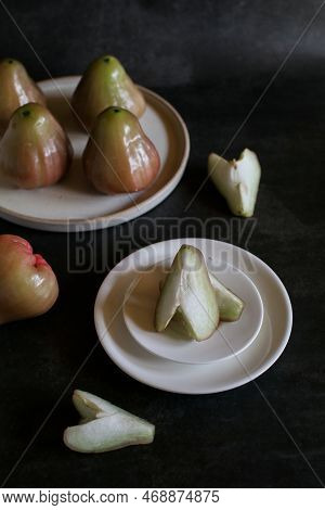 Rose Apple Or Jambu On Dark Background. Thailand Apple Tropical Fruit Flavors Of Sweet Red Gloss.