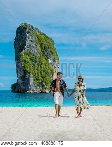 Koh Poda Krabi Thailand, Asian Woman And European Men Walking On The Tropical Beach Of Koh Poda