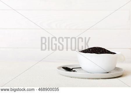 Quinoa Seeds In Bowl On Colored Background. Healthy Kinwa In Small Bowl. Healthy Superfood.