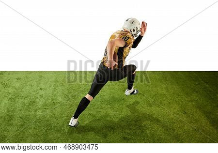 Man, American Football Player In Motion, Training, Running On Grass Field Over White Studio Backgrou