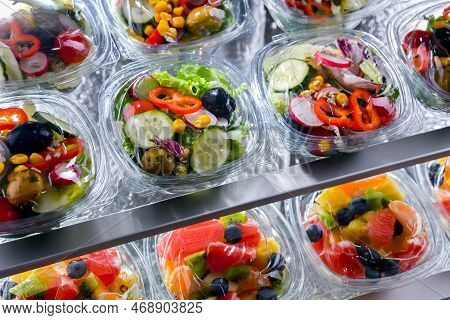 Boxes With Pre-packaged Vegetable Salads In A Commercial Fridge