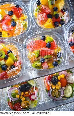 Boxes With Pre-packaged Fruit Salads In A Commercial Fridge