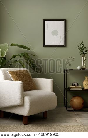 Stylish Composition Of Living Room Interior With Mock Up, Green Wall, White Armchair With Brown Pill
