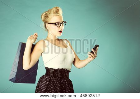 Woman Texting While Looking Surprised On Phone