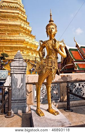 BANGKOK, THAILAND - JAN 4, 2012: a kinaree a mythology figure is watching the temple in the Grand Palace