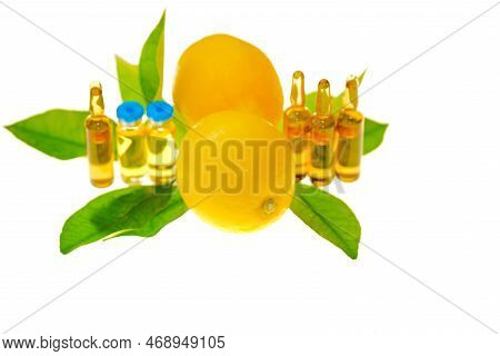 Vitamin C Solution, Lemons Fruits With Leaves On A White Background .injections With Vitamin C.beaut