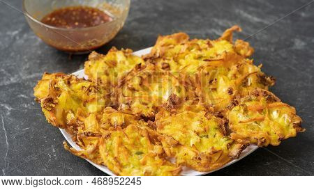 Bakwan Is A Fried Food Made From Vegetables And Flour That Is Commonly Found In Indonesia. Served Wi