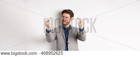 Rude Businessman In Suit Showing Middle Finger, Fuck You Gesture, Look Annoyed And Pissed-off, Stand