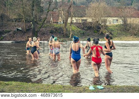 Vilnius, Lithuania - January 15 2023: Group Of People Ice Bathing Together In The Cold Water Of A Ri