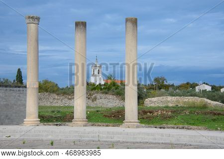 Ruins Of The Old Roman City Of Conimbriga In Portugal With A Medieval Church In The Background