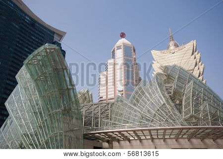 MACAU, CHINA - NOVEMBER 2, 2012: Casinos buildings and Illuminated glass installation in modern area of Macau. Macau is the gambling capital of Asia and is visited by about 29 million tourists year