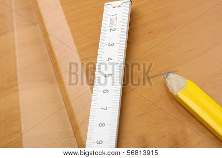 Wooden board and tools on a white background