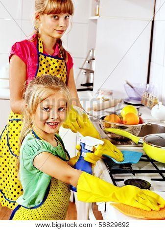 Children cleaning  kitchen. Housekeeping.