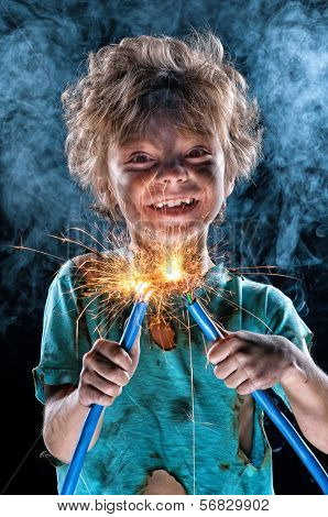 Portrait of little crazy electrician over black background