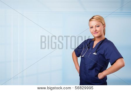 Pretty young nurse in hospital listening to empty copy space with sthetoscope