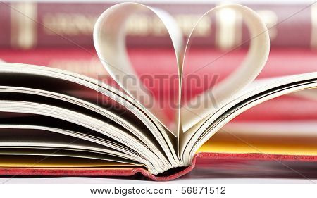 Close up on heart shaped book pages 